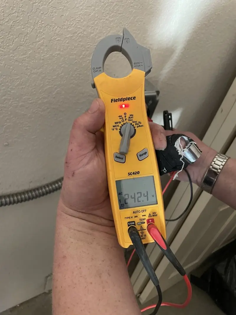 Voltage testing with clamp meter during Circuit Breaker Repair in Groton